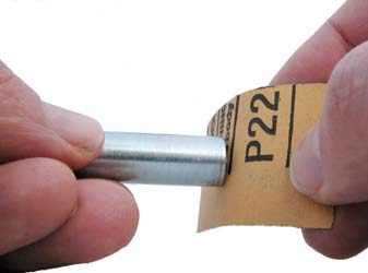 Insert sandpaper on hub tool